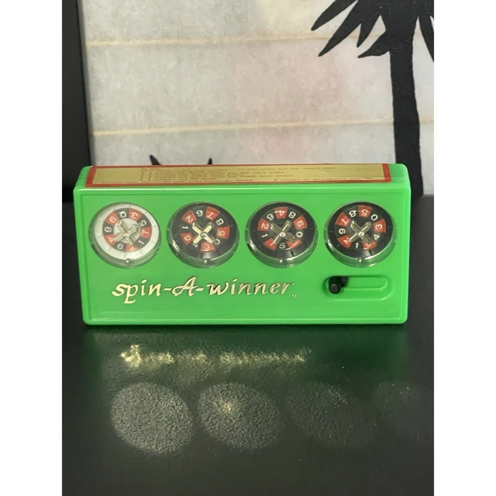 VINTAGE SPIN-A-WINNER PLASTIC HAND HELD GAME Portable Game from 1984 Megabucks